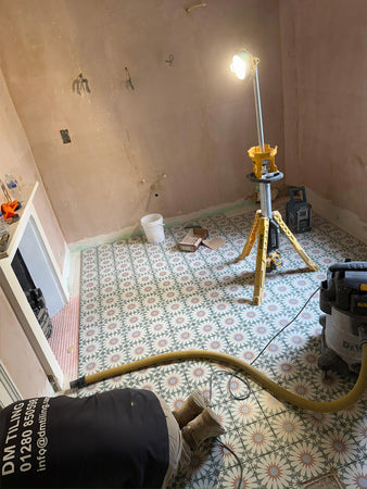 Abingdon - sweet floor tiles are being laid in the family bathroom.