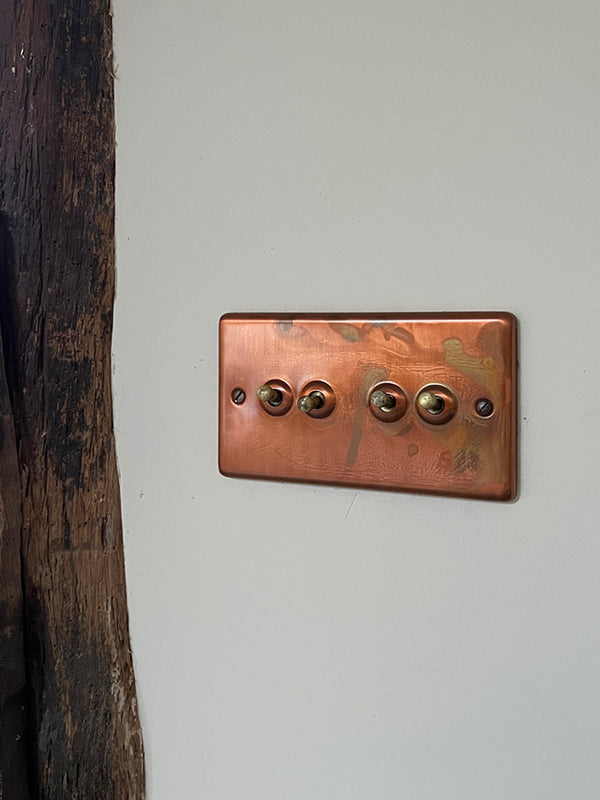 A delicious combination of copper switches, original beams and Farrow & Ball Wimborne White