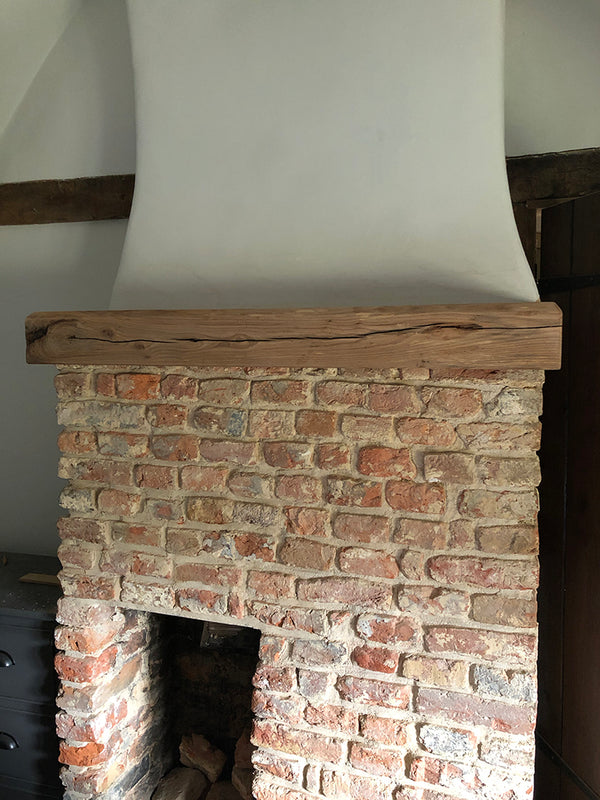 Brockenhurst 1 - the refurbed fireplace has his custom-made oak top hat, made by Fusion by Fawn