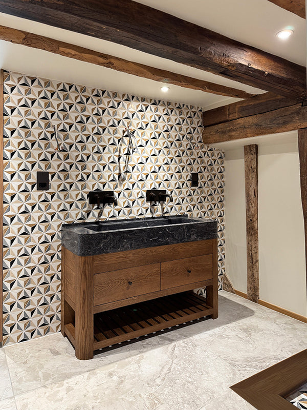 Maidstone - bespoke double vanity unit with curved solid oak legs and curved Corian trough basin. Set against Artisans of Devizes marble tiles and original beams
