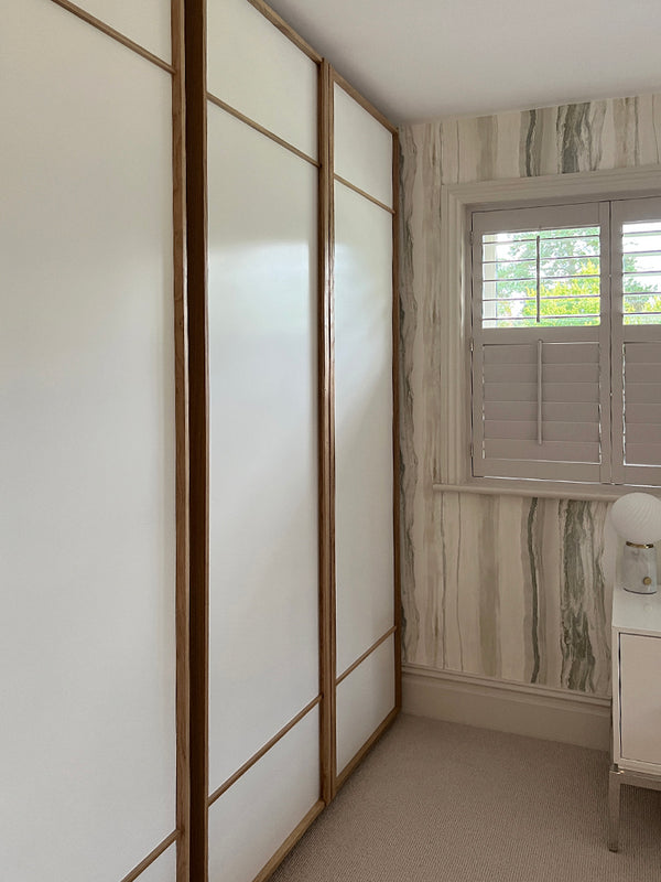 Andover - oak framed wardrobe, with Harlequin marble-esque wallpaper